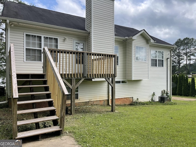 127 Mabry Rd, Jackson, GA 30233 - back of property with a chimney, stairway, a lawn, a deck, and central AC