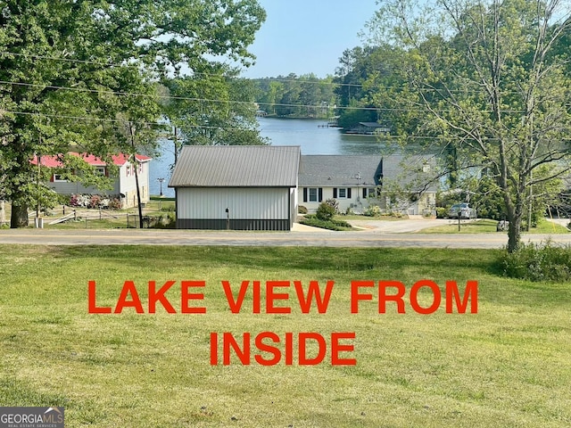 127 Mabry Rd, Jackson, GA 30233 - view of front of property with a front lawn, a water view, and a metal roof