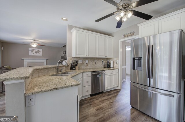 3186 Sail Winds Dr NW, Acworth, GA 30101 - kitchen featuring ceiling fan, appliances with stainless steel finishes, tasteful backsplash, a sink, and dark wood-type flooring