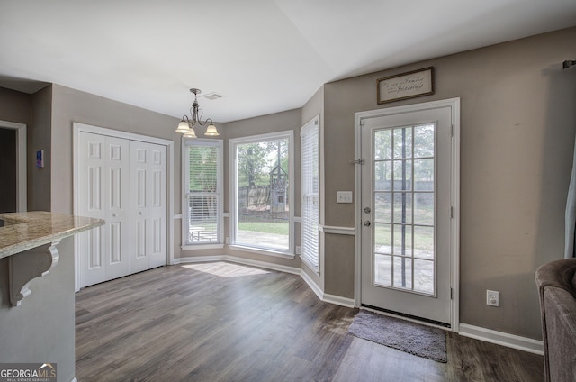 3186 Sail Winds Dr NW, Acworth, GA 30101 - entryway featuring dark wood-style floors and a chandelier