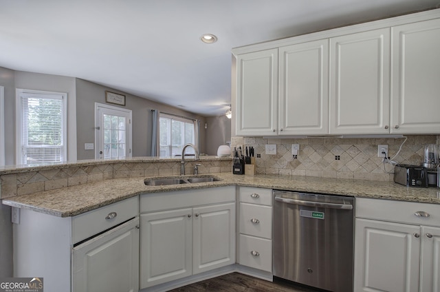 3186 Sail Winds Dr NW, Acworth, GA 30101 - kitchen with white cabinets, a sink, backsplash, stainless steel dishwasher, and dark wood-style floors