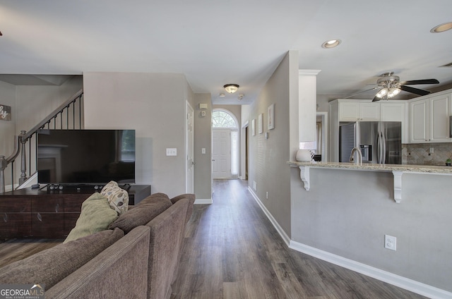 3186 Sail Winds Dr NW, Acworth, GA 30101 - living room featuring ceiling fan, dark wood finished floors, stairway, and recessed lighting