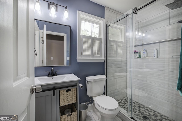 3186 Sail Winds Dr NW, Acworth, GA 30101 - bathroom featuring toilet, a shower stall, and vanity