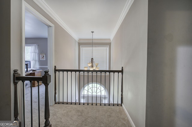 3186 Sail Winds Dr NW, Acworth, GA 30101 - corridor with carpet flooring, a chandelier, and ornamental molding