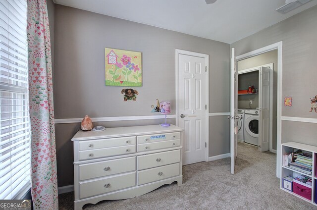 3186 Sail Winds Dr NW, Acworth, GA 30101 - bedroom with visible vents, light carpet, and washing machine and clothes dryer