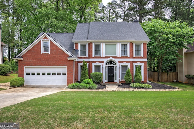 3186 Sail Winds Dr NW, Acworth, GA 30101 - view of front of home featuring a garage, fence, driveway, and a front yard