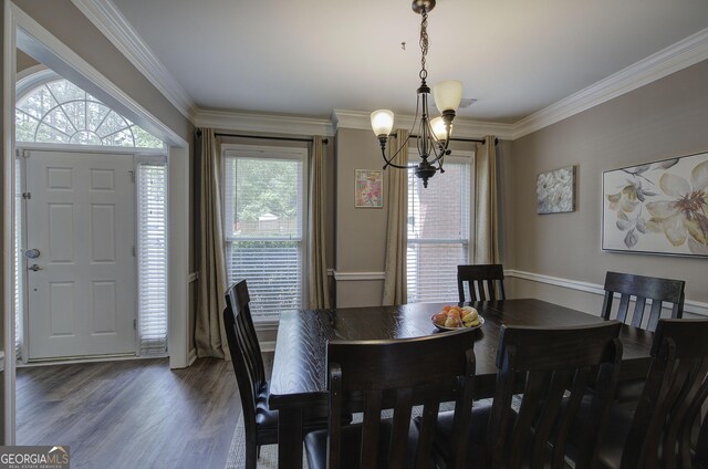 3186 Sail Winds Dr NW, Acworth, GA 30101 - dining area featuring an inviting chandelier, crown molding, and wood finished floors
