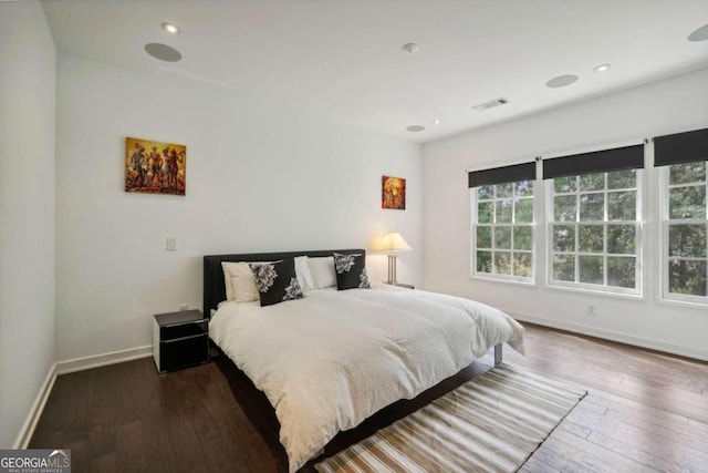 bedroom featuring recessed lighting, baseboards, visible vents, and wood finished floors