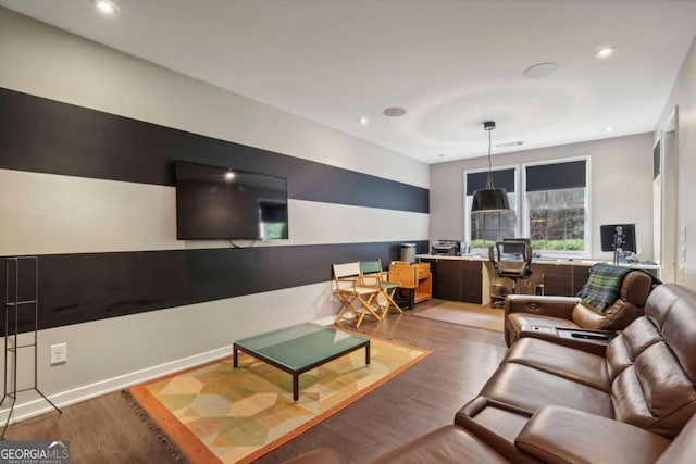 living area with recessed lighting and wood finished floors