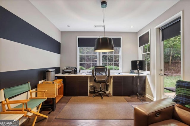 office featuring recessed lighting, visible vents, plenty of natural light, and wood finished floors