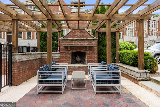 view of patio / terrace featuring a pergola and an outdoor living space with a fireplace