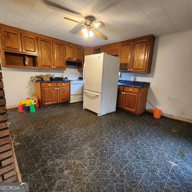 kitchen featuring under cabinet range hood, brown cabinetry, white appliances, and a ceiling fan