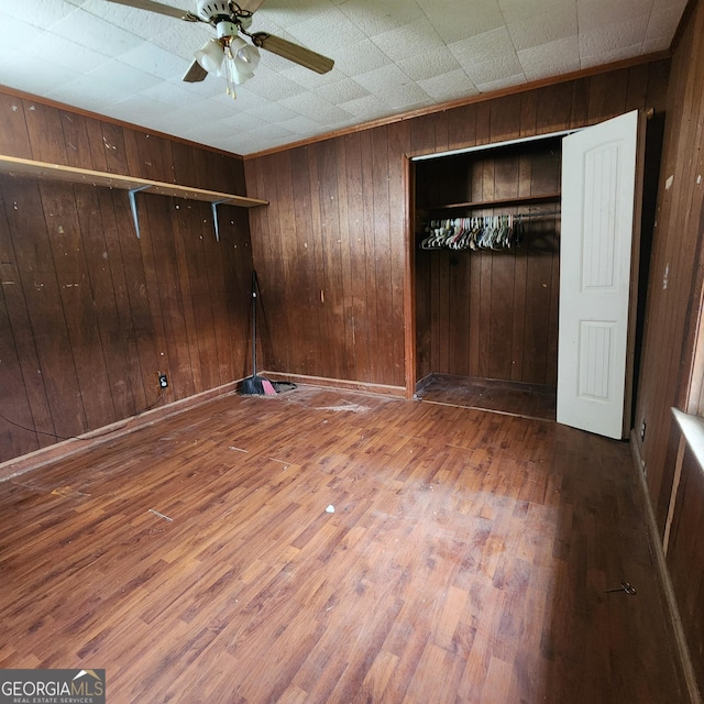 interior space with wood walls and wood finished floors