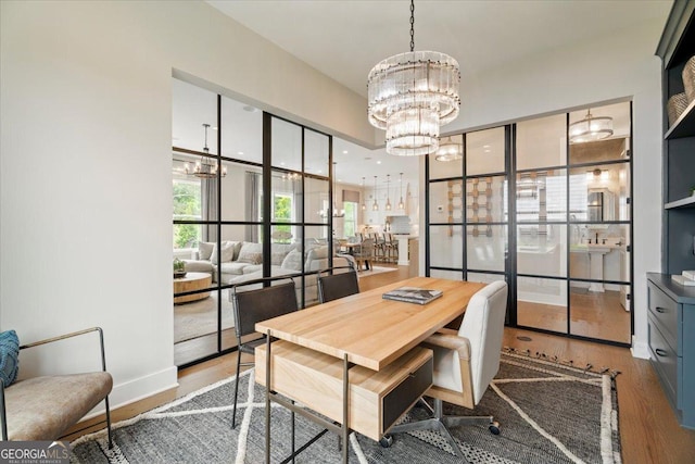 3525 Brynhurst Dr, Cumming, GA 30028 - office area with an inviting chandelier, baseboards, and wood finished floors