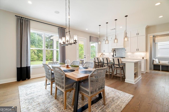 3525 Brynhurst Dr, Cumming, GA 30028 - dining area featuring visible vents, recessed lighting, a chandelier, light wood-style flooring, and baseboards