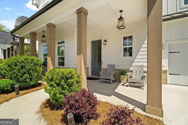 3525 Brynhurst Dr, Cumming, GA 30028 - view of exterior entry with covered porch and a garage