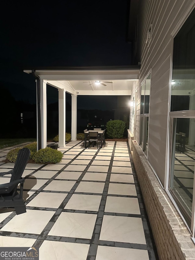 3525 Brynhurst Dr, Cumming, GA 30028 - patio at night with outdoor dining space