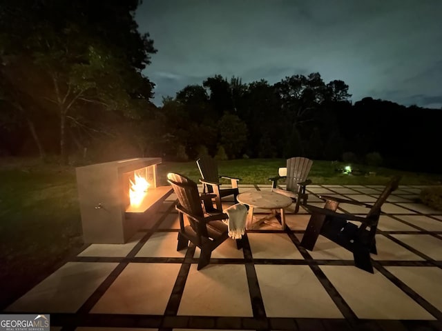 3525 Brynhurst Dr, Cumming, GA 30028 - patio at night featuring an outdoor fire pit