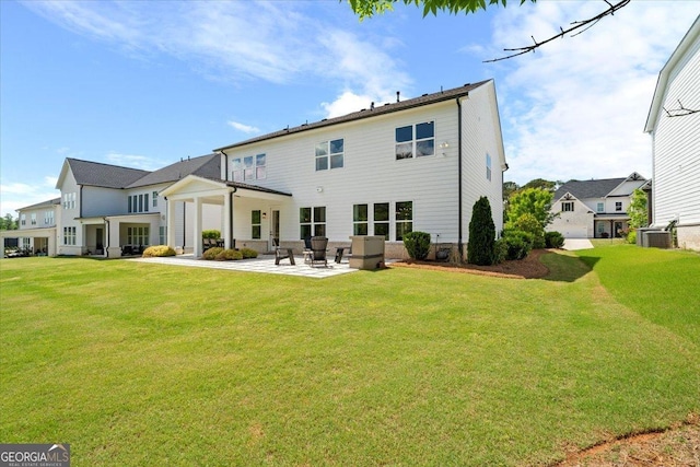 3525 Brynhurst Dr, Cumming, GA 30028 - back of property with an attached garage, a patio, a lawn, and cooling unit