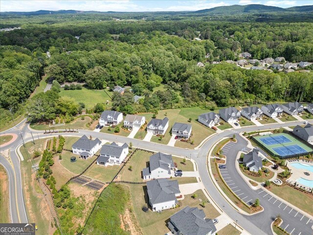 3525 Brynhurst Dr, Cumming, GA 30028 - drone / aerial view featuring a wooded view and a residential view