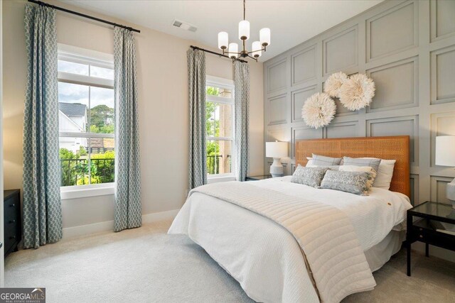 3525 Brynhurst Dr, Cumming, GA 30028 - bedroom with carpet, a notable chandelier, baseboards, and visible vents