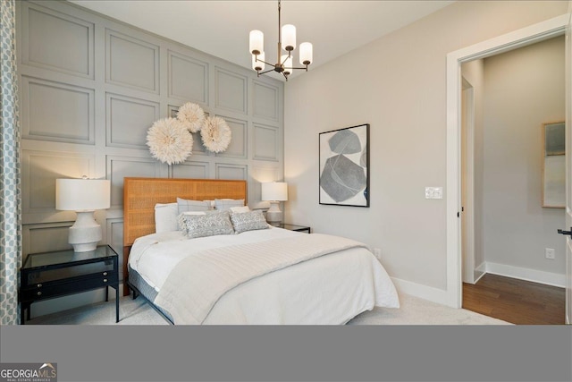 3525 Brynhurst Dr, Cumming, GA 30028 - bedroom featuring baseboards and a chandelier