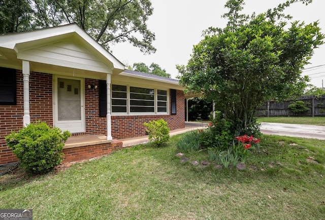120 Hunt Rd, Athens, GA 30606 - view of front of house featuring brick siding, fence, and a front yard