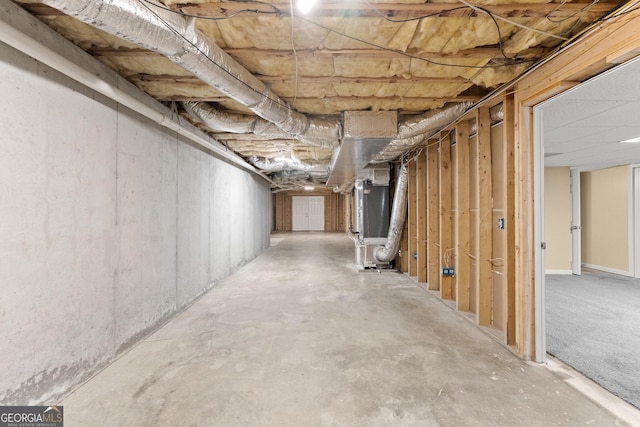 unfinished below grade area featuring heating unit
