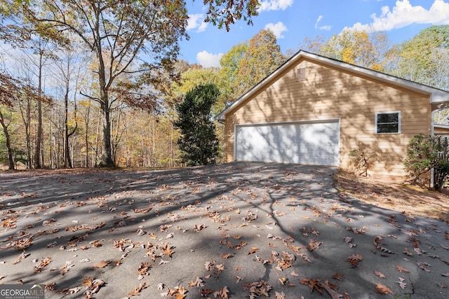 view of property exterior featuring driveway