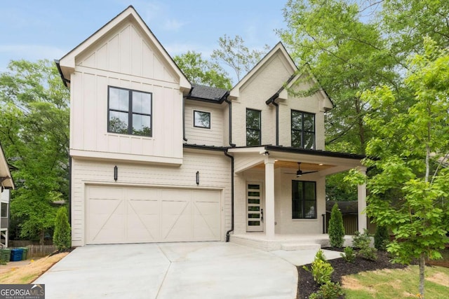 modern farmhouse with board and batten siding, covered porch, driveway, a ceiling fan, and a garage