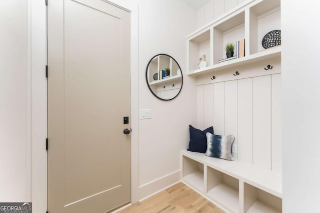 mudroom with baseboards and light wood-type flooring