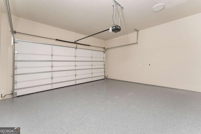 garage featuring baseboards and a garage door opener