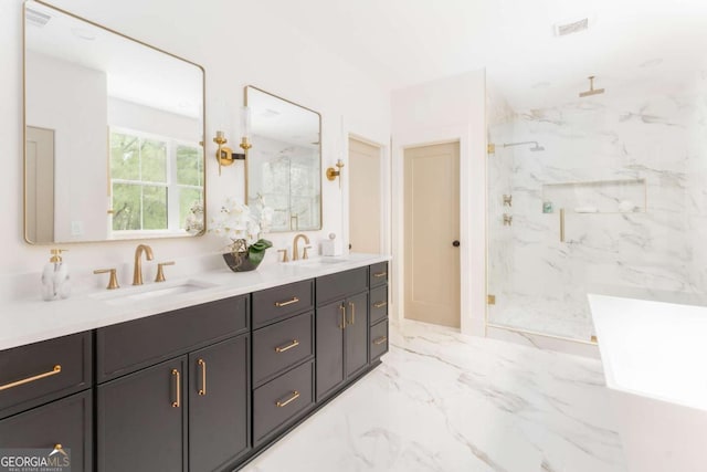 bathroom featuring a sink, a marble finish shower, double vanity, and marble finish floor