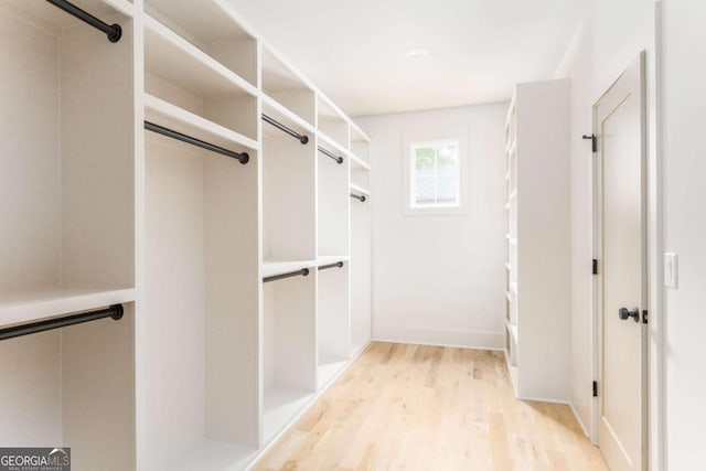 spacious closet with light wood finished floors