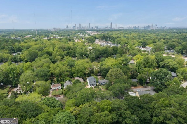 bird's eye view featuring a view of city and a forest view