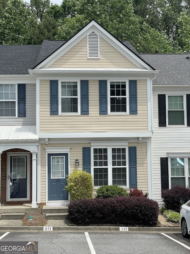 211 Buckland Dr, Alpharetta, GA 30022 - view of property with entry steps and uncovered parking
