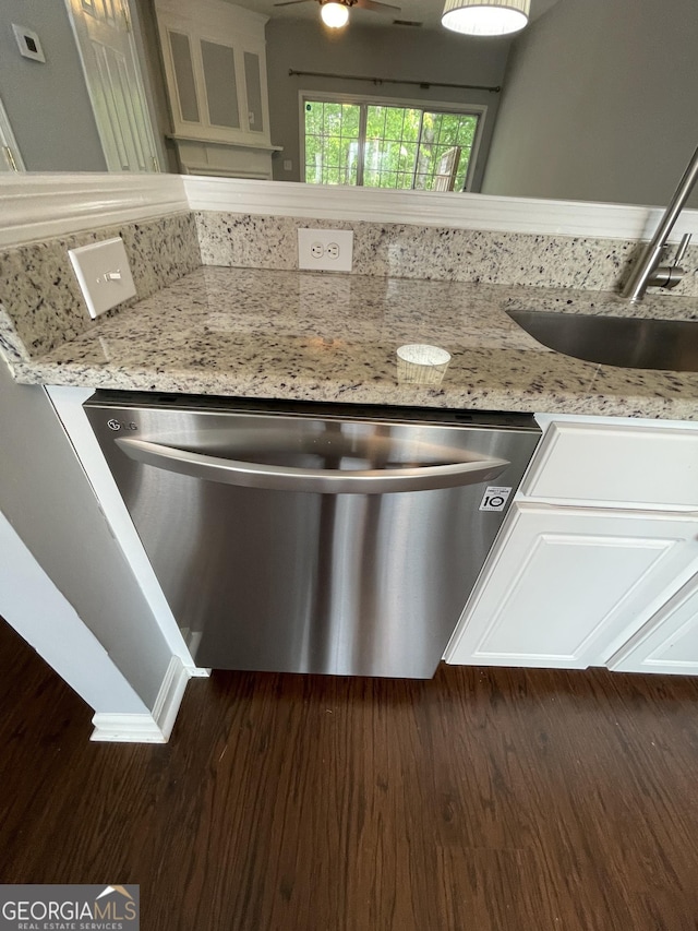211 Buckland Dr, Alpharetta, GA 30022 - kitchen featuring stainless steel dishwasher, dark wood-style floors, a sink, and light stone counters