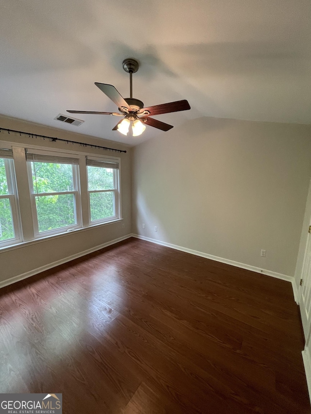 211 Buckland Dr, Alpharetta, GA 30022 - unfurnished room featuring vaulted ceiling, dark wood-style floors, ceiling fan, and baseboards