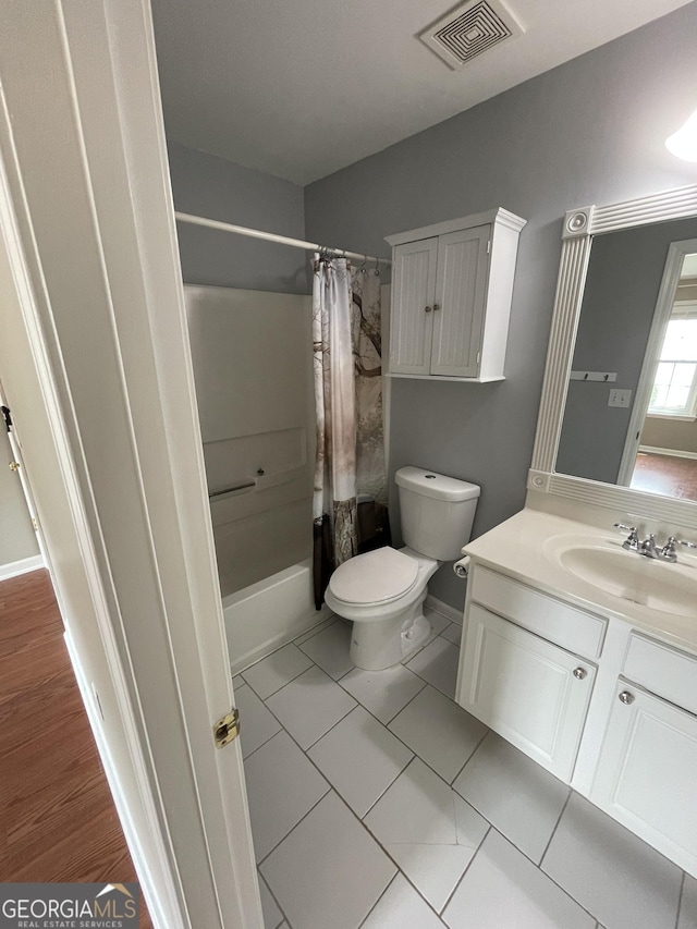 211 Buckland Dr, Alpharetta, GA 30022 - full bath with vanity, toilet, shower / bath combo, and tile patterned flooring