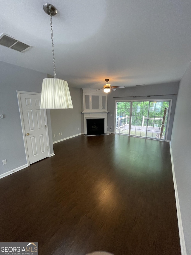 211 Buckland Dr, Alpharetta, GA 30022 - unfurnished living room featuring dark wood-style flooring, baseboards, ceiling fan, and a fireplace