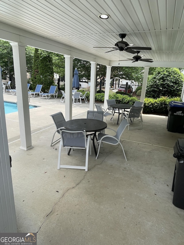 211 Buckland Dr, Alpharetta, GA 30022 - view of patio with outdoor dining area, fence, a ceiling fan, and a community pool
