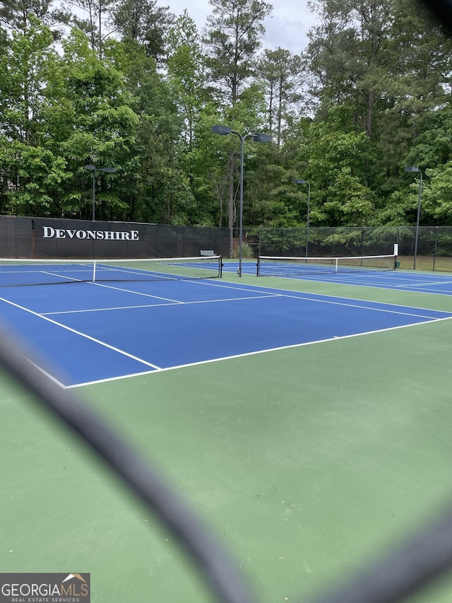 211 Buckland Dr, Alpharetta, GA 30022 - view of tennis court with community basketball court and fence