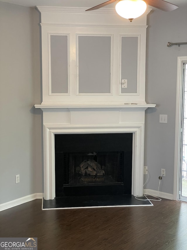 211 Buckland Dr, Alpharetta, GA 30022 - detailed view of ceiling fan, wood finished floors, a fireplace with raised hearth, and baseboards