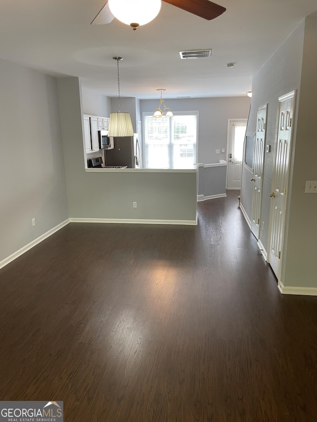 211 Buckland Dr, Alpharetta, GA 30022 - unfurnished living room with a ceiling fan, dark wood finished floors, and baseboards
