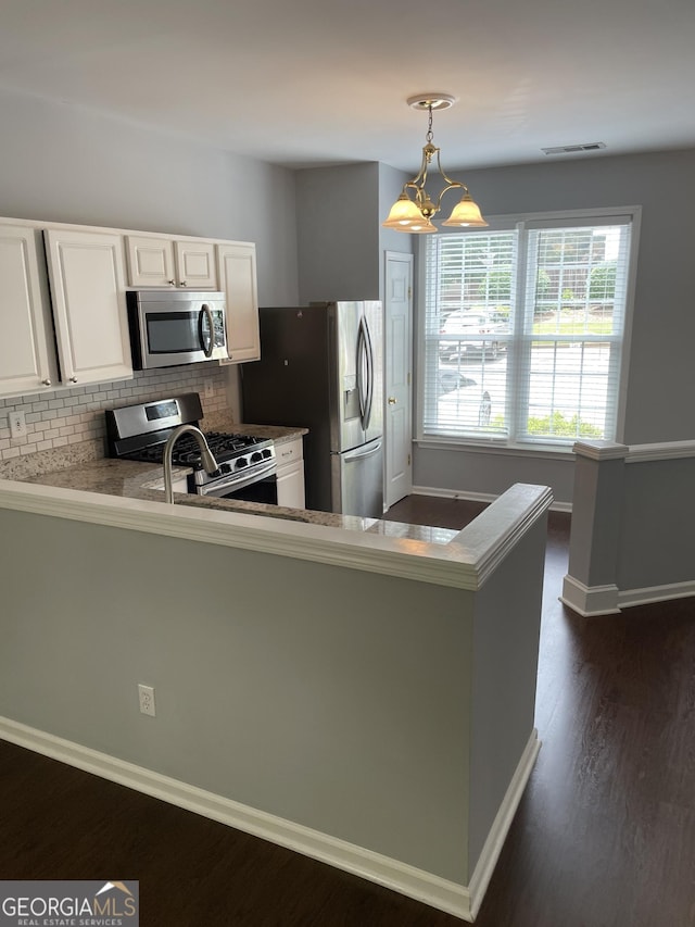 211 Buckland Dr, Alpharetta, GA 30022 - kitchen with appliances with stainless steel finishes, backsplash, white cabinets, dark wood-style flooring, and baseboards
