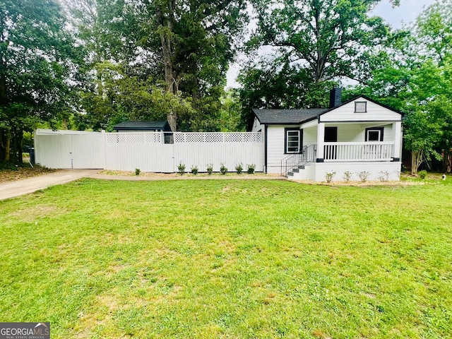 2502 Barge Rd SW, Atlanta, GA 30331 - view of front of property with covered porch, fence, driveway, and a front yard