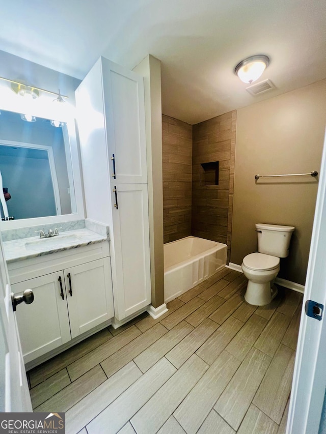 2502 Barge Rd SW, Atlanta, GA 30331 - full bathroom featuring vanity, toilet, visible vents, and wood tiled floor
