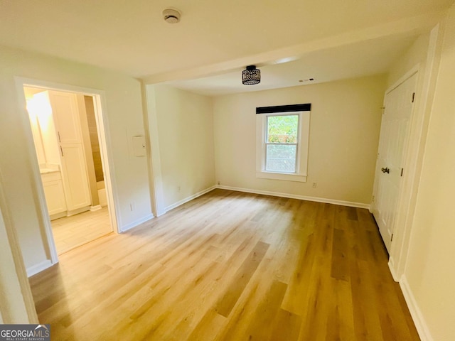 2502 Barge Rd SW, Atlanta, GA 30331 - unfurnished bedroom with baseboards, ensuite bath, visible vents, and light wood-style floors