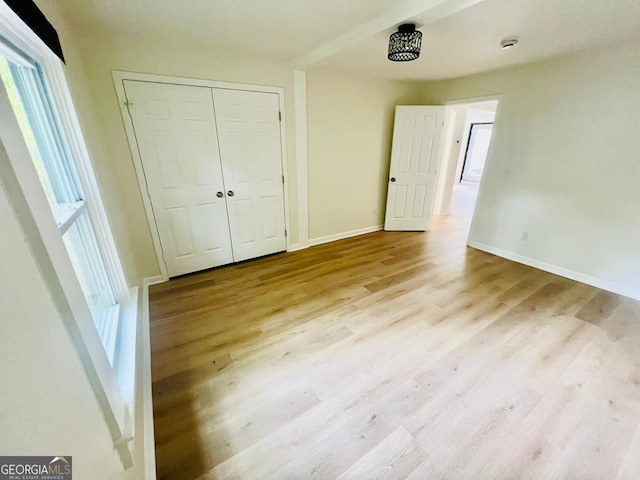 2502 Barge Rd SW, Atlanta, GA 30331 - unfurnished bedroom with baseboards, a closet, and wood finished floors