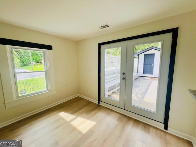 2502 Barge Rd SW, Atlanta, GA 30331 - doorway to outside featuring visible vents, plenty of natural light, french doors, and light wood-style flooring